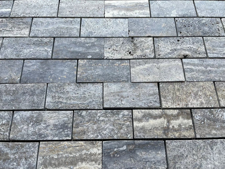 Blue travertine 1x2 brick mosaic wall tile, brushed and semi-polished finish.