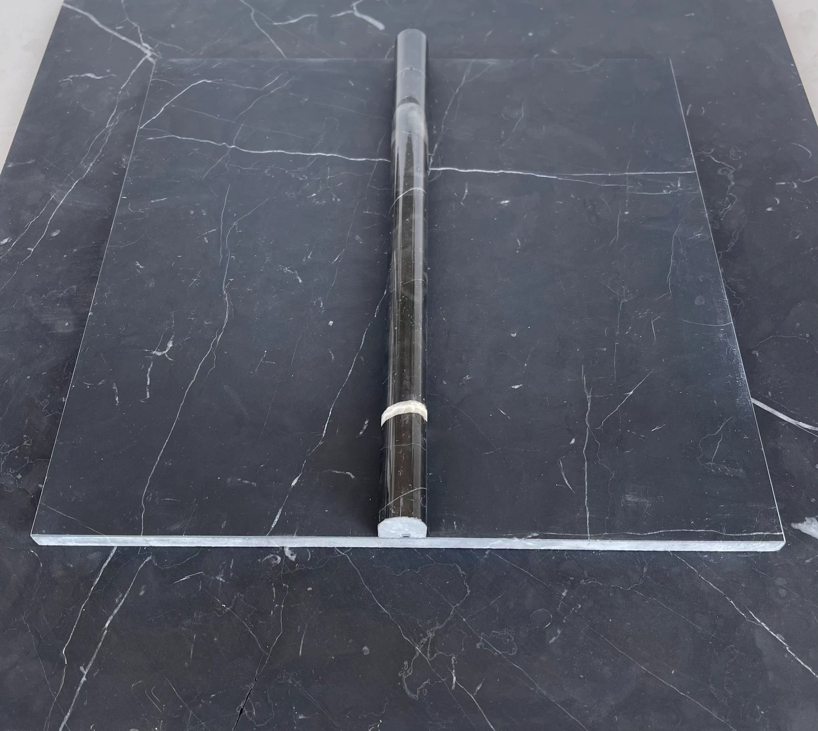 Nero Marquina marble bullnose liner tile, deep black with white veining, polished/honed